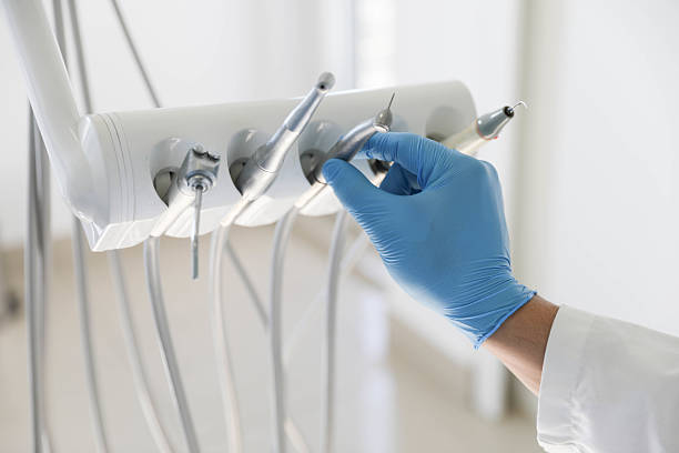 Professional Tooth Extraction technician working in West St. Paul, MN